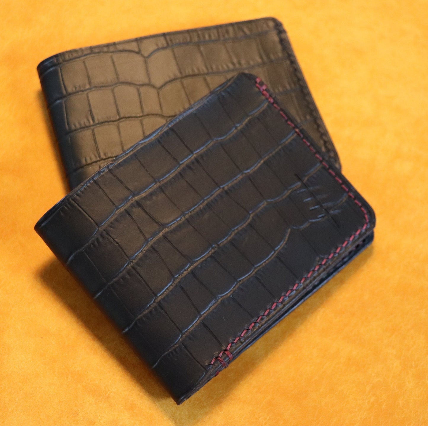 The Elder Bi-fold wallet in Crocodile Embossed Full grain Italian leather.